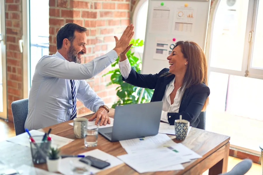 Two people collaborating on a web project together